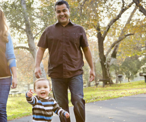 Family with toddler taking a walk